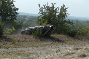 The RIPSAW-MS1 demonstrates its off road capabilities during a lanes exercise at the Fort Hood Robotics Rodeo. The RIPSAW is equipped with six claymore mines, can carry 5,000 pounds and tow multiple military vehicles. The RIPSAW is designed to be an unmanned convoy security vehicle and takes the Soldier out of harms way.